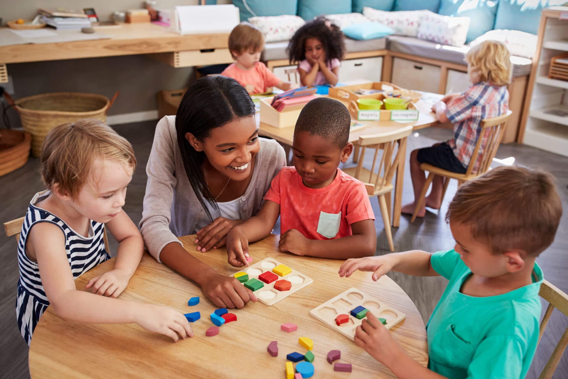 A Creation Kingdom teacher engaging children in a classroom activity