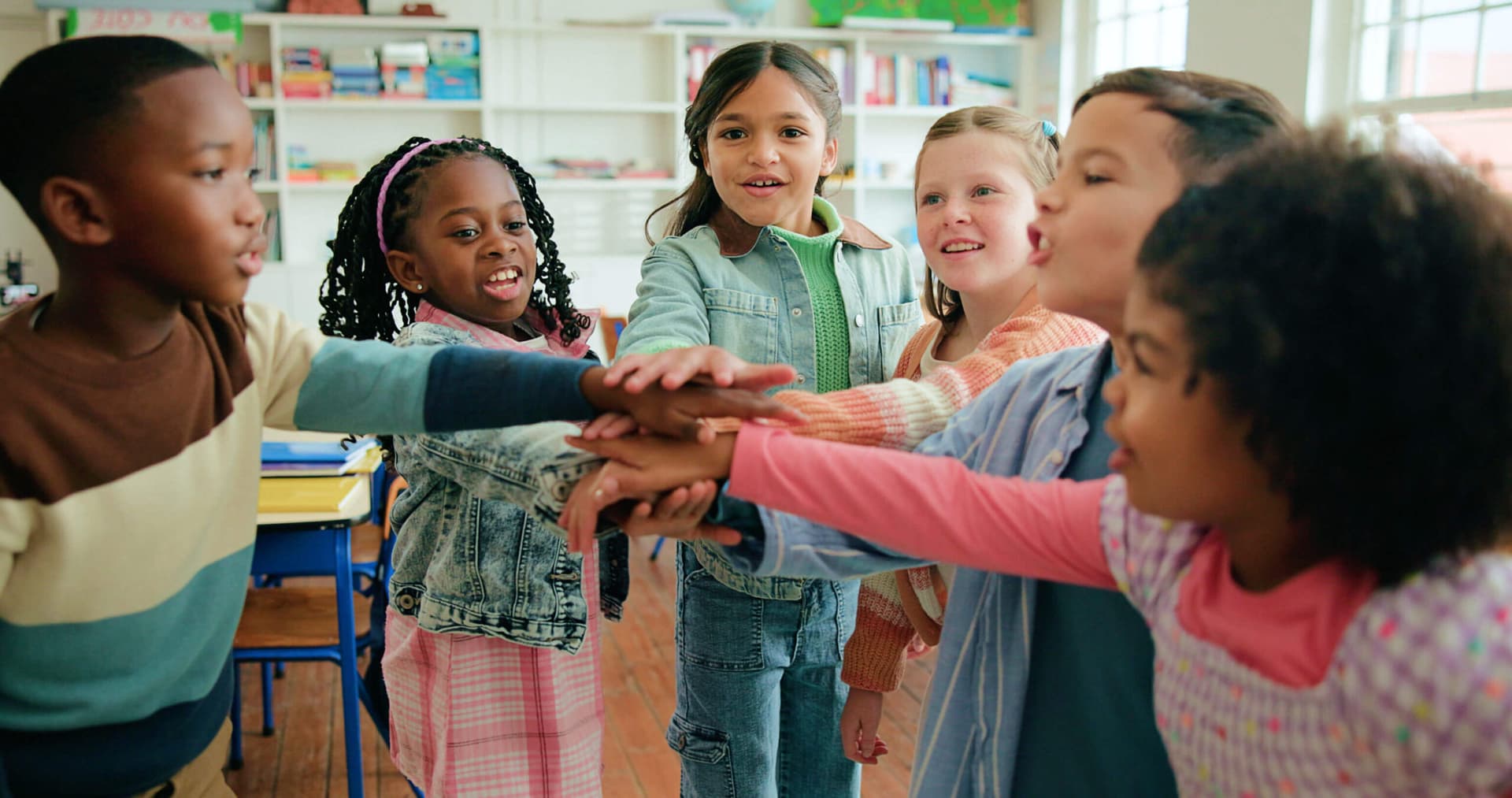 A teacher playing with children at Creation Kingdom Shawnee