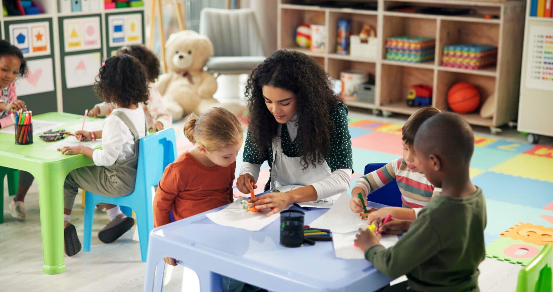 A Creation Kingdom teacher working with children